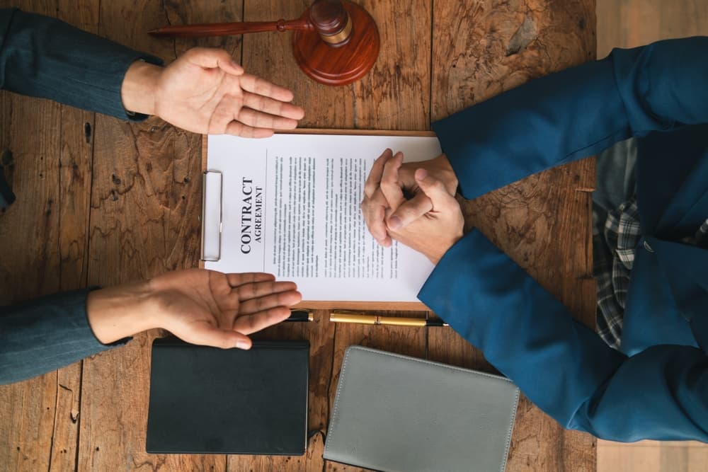 contract of sale was placed on the table in the lawyer office because the company hired the lawyer office as a legal advisor and drafted the contract so that the client could sign the right contract.