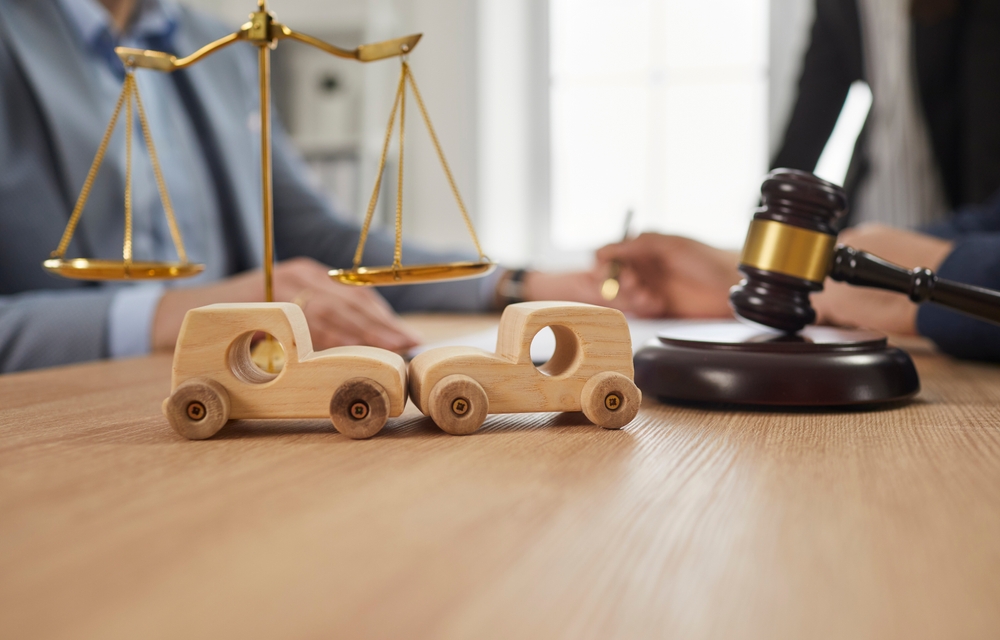 Two Small Wooden Toy Car Hit Each Other.