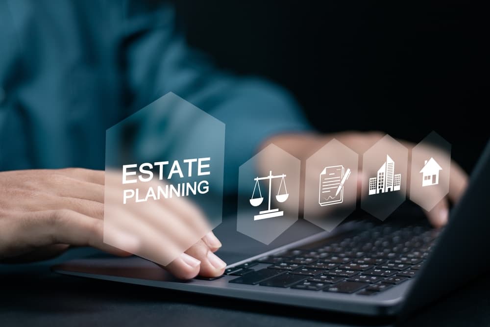 A person typing on a laptop with floating icons representing estate planning, legal documents, and property.