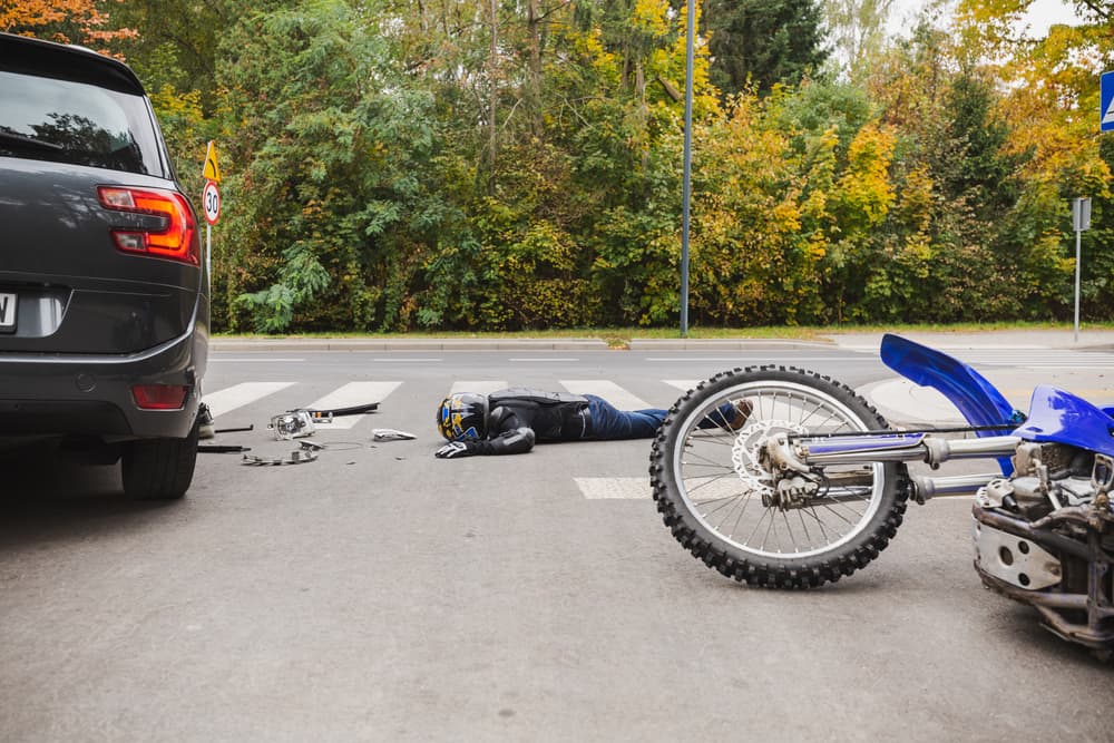 Tragic car and motorcycle accident with unconscious man