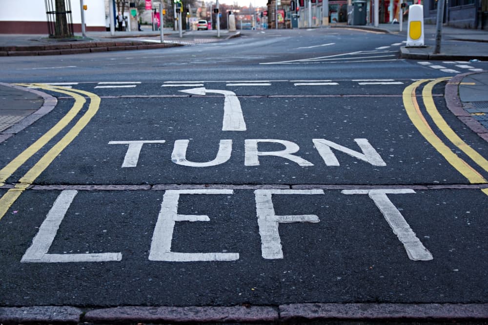 Road white markings Turn Left with the arrow showing the direction