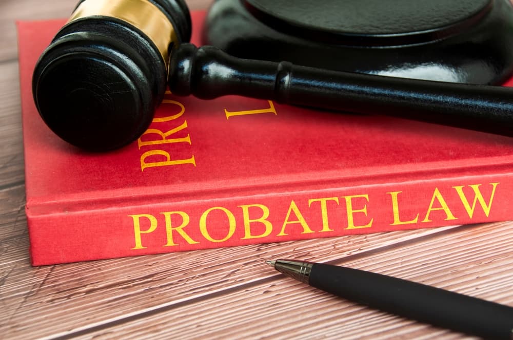 Judge gavel and Probate Law book on wooden desk.